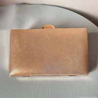 Matte gold metallic side of evening clutch