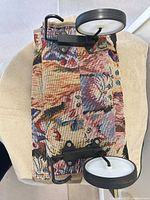 Bottom view of cart base with foldable metal frame and wheels