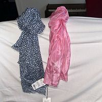 Both scarves draped to show size, colour and pattern