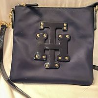 front view showing H appliqué and gold studs