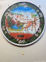 Front view showing entire round glass plaque, Santa scene, 1984 date and hanging eyelets