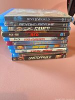 Stack of nine 4K Ultra HD movie cases, titles visible