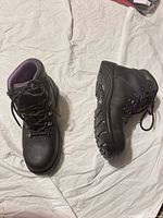 Top view of both boots showing overall design, purple lining and laces