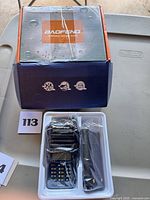 Retail box and tray with radio and battery sealed