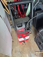 Front view of CleanForce 1800 PSI pressure washer with hose on reel