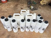 Group shot of 12 Eco-Feu 946 ml bottles and 4 Eco-Feu 3.78 L jugs