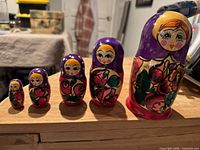 Five nesting dolls displayed in size order