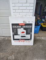 Boxed Imperial stove board leaning against wall