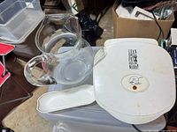 Glass pitcher, white George Foreman grill top, white drip tray