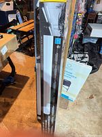 Side view of boxed KOB LED shop light showing length and packaging