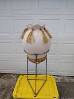 Full view of pot on stand showing overall size and design