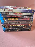 Stack of ten Blu-ray movie cases showing all titles on spines