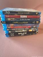 Stack of ten Blu-ray cases showing all titles