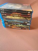 Stack of nine Blu-ray cases side view showing cover art