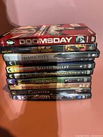 Stack of 10 DVD cases showing titles
