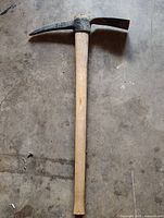 Full view of Ludell pickaxe showing wood handle and steel head