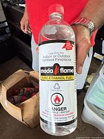Close-up of one sealed Moda Flame Pure Ethanol Fuel 1-quart bottle