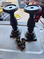 pair of candlesticks with four small cups