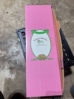 Side view of pink polka-dot Paradise Galleries Treasure Collection box