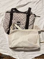 Both handbags laid flat for overall view