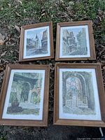 All four framed prints laid out on grass