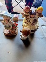 Overview of three visible figurines on table