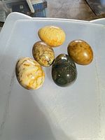 Five jasper eggs on a flat surface showing overall lot