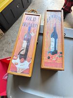 Two Vineyard Collection wooden wine boxes closed showing printed fronts