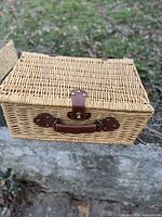 closed wicker picnic basket showing exterior and handle