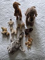 Group shot showing all nine stuffed animals
