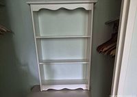 Front view of white 3-shelf bookcase showing overall design