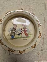Top view showing interior rabbit scene and rim pattern