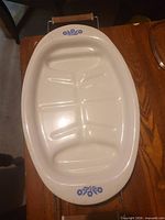 Top view of platter showing blue floral motifs and drip channels