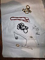 Overview of all jewelry pieces on paper