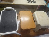 Group shot of three step stools showing overall types and wear