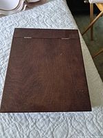 closed view of wooden lap desk top surface