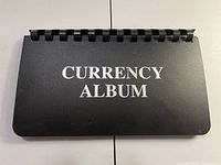 Front cover of black currency album