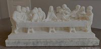 Front view of white Last Supper statue on marble pedestal
