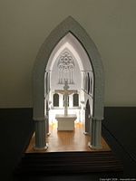 Front lit view of church chancel model showing interior lighting and crucifix