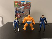 Three Fantastic Four action figures with packaging