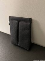 Front view of fabric jewelry pouch standing upright