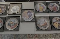 Nine Star Trek anniversary plates in boxes