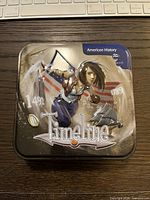 tin box front artwork showing female character and U.S. flag