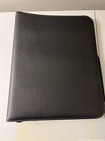 Closed black zippered binder