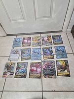 All fifteen jumbo Pokémon cards laid out on floor