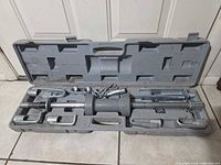 Open case displaying full dent puller set