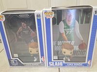 Both boxed Luka Doncic Funko Pops side by side