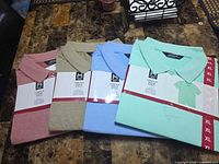 All four packaged polo shirts displayed