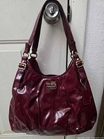 Front view showing full handbag, straps, overall condition