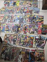 Full layout of entire comic book lot spread on floor